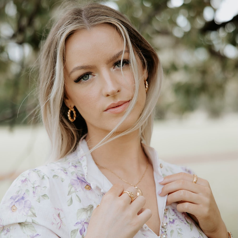
                      
                        Twisted Hoop Earrings
                      
                    