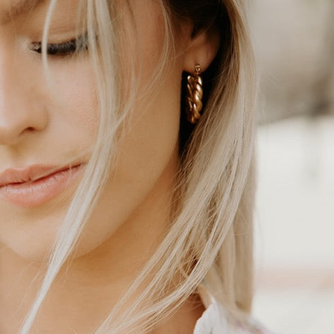 
                      
                        Twisted Hoop Earrings
                      
                    